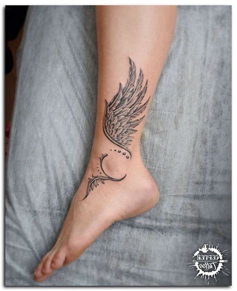 wings on ankle tattoo